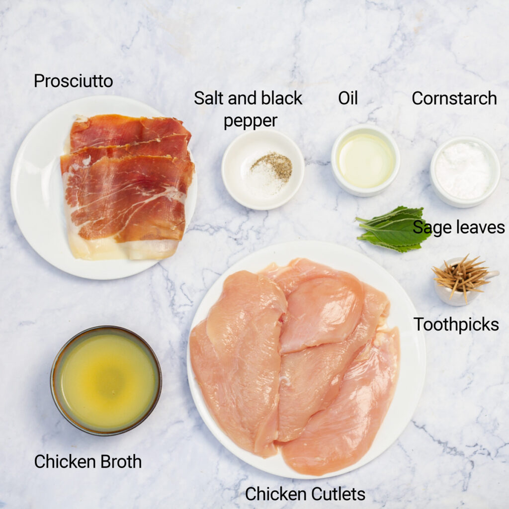 A flat lay of ingredients for chicken saltimbocca, including chicken cutlets, prosciutto, sage leaves, toothpicks, salt, pepper, oil, cornstarch, and chicken broth.